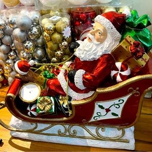 Santa clause in a sleigh pulled by 2 reindeer